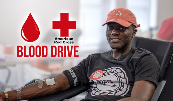 Man participating in blood drive