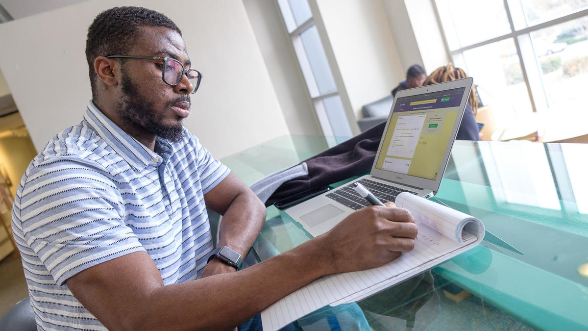 Student taking survey on laptop