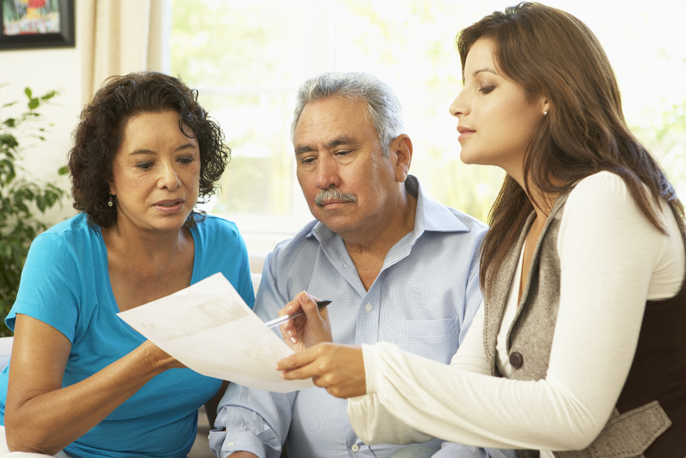 Financial Planner Explaining using paper and pen