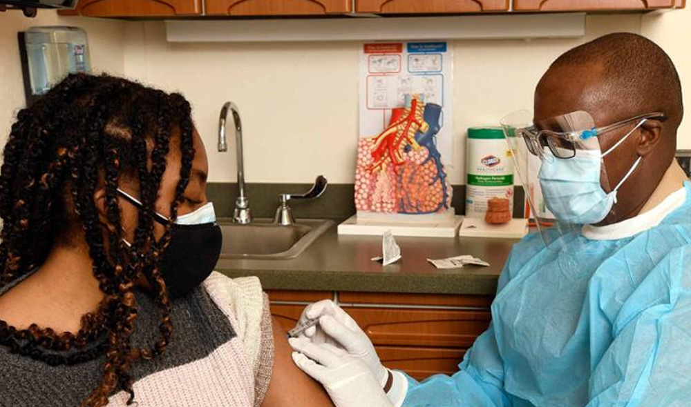 A doctor administering a vaccine.