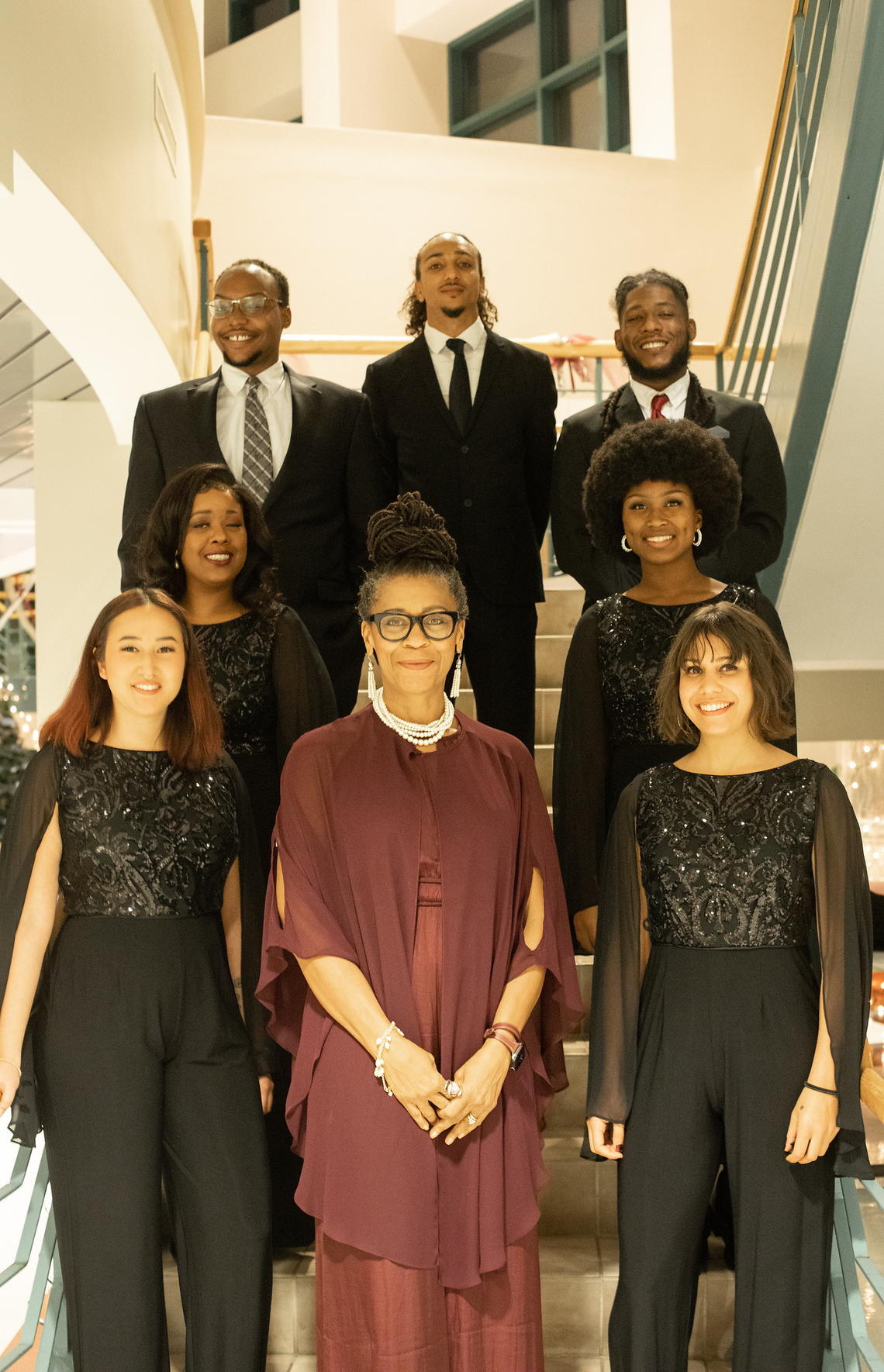 Jazz ensemble posing together on stairs