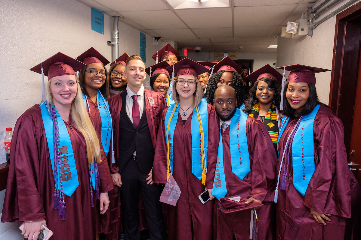 students in caps and gowns