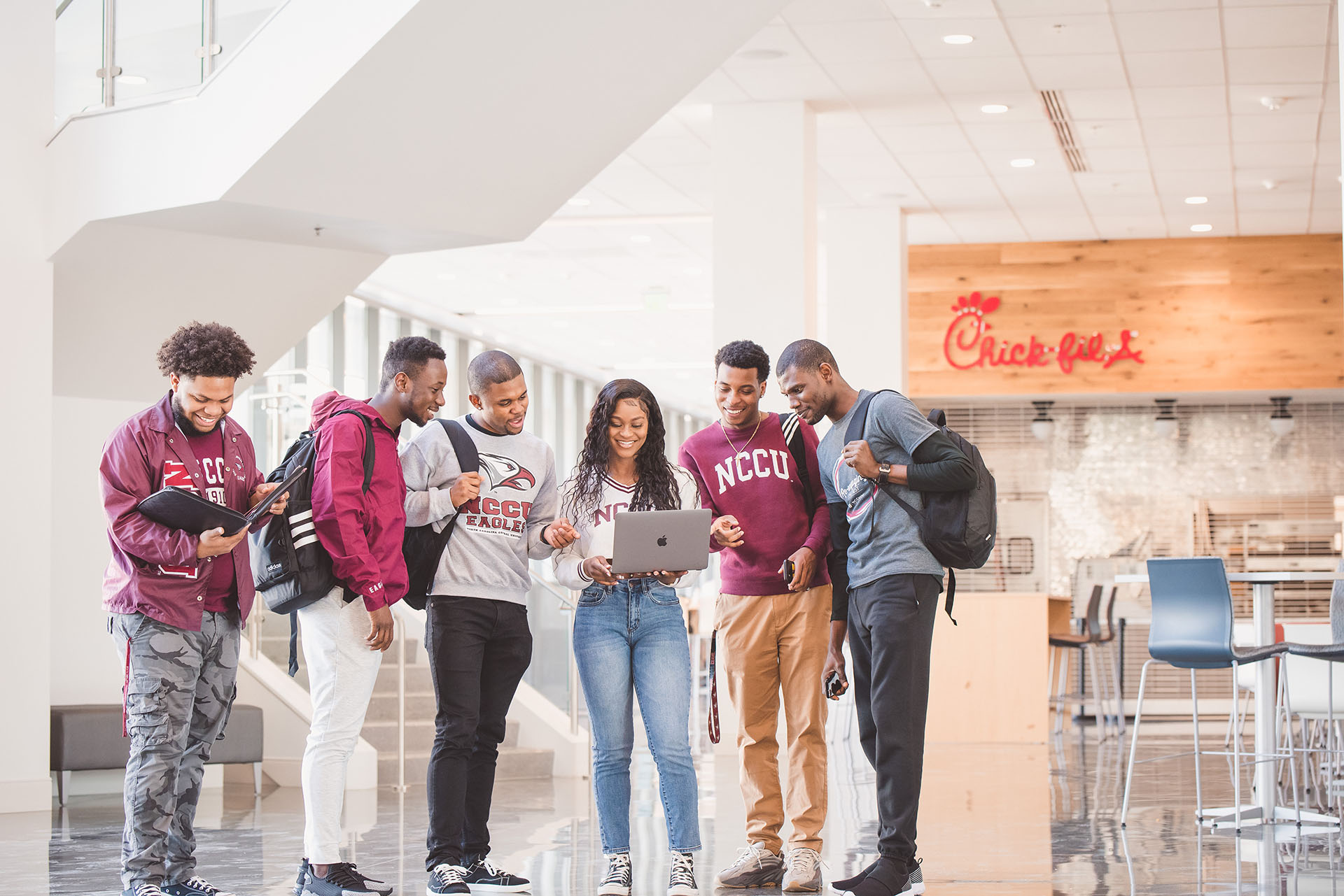 Students looking on a laptop