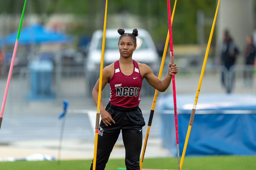A young female track athelete holding a javelin 