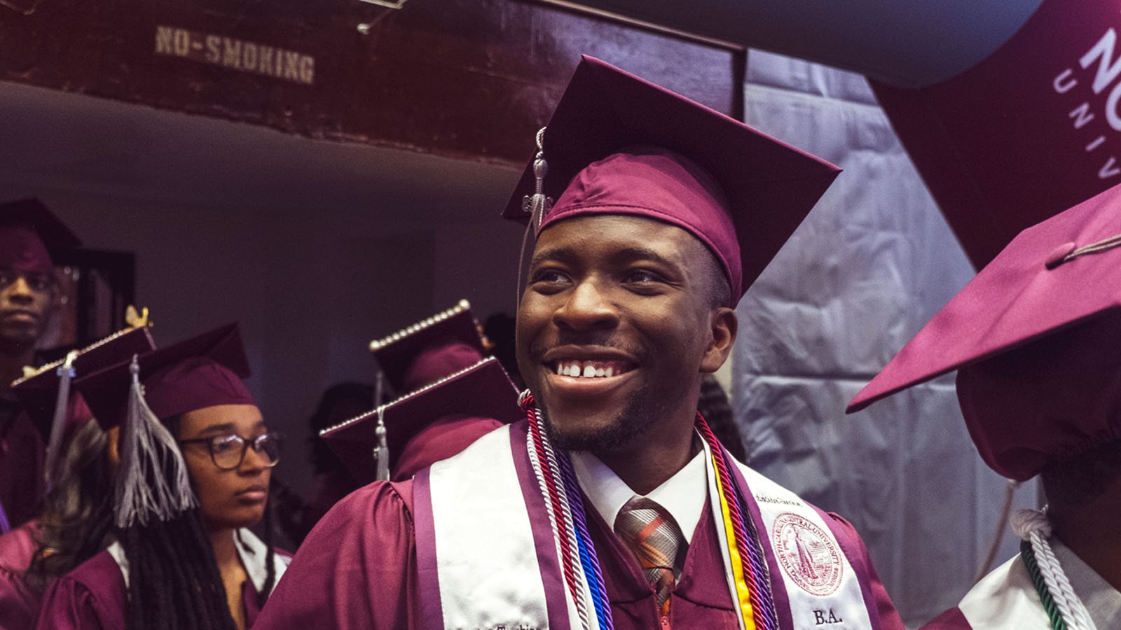 Student smiling at commencement