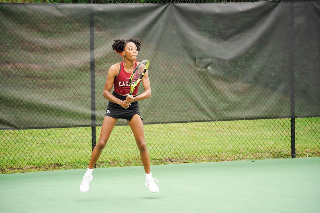 NCCU Tennis player prepares to receive a serve