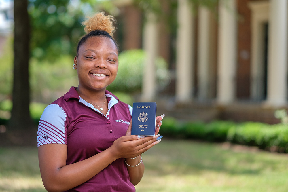 Student holding passport