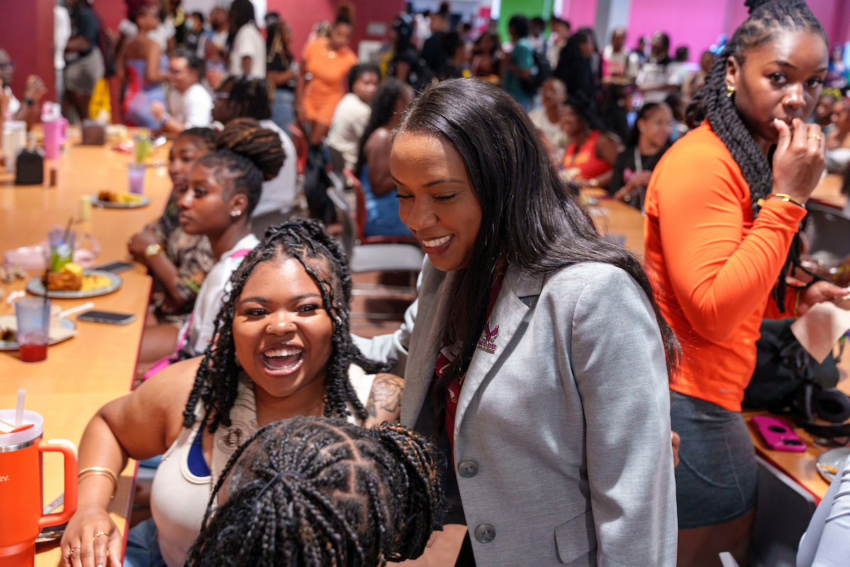 Chancellor with Students on Cafeteria
