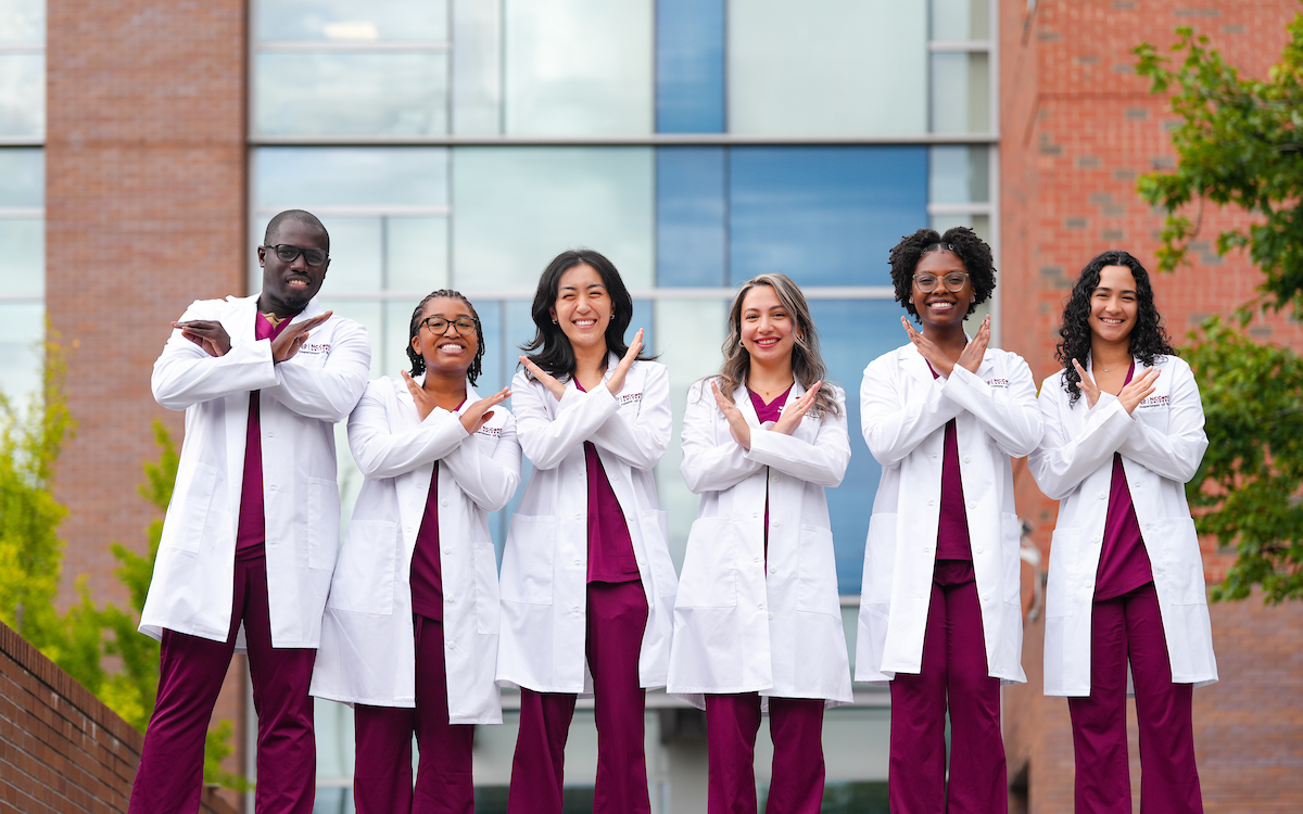 Nursing students on white coat