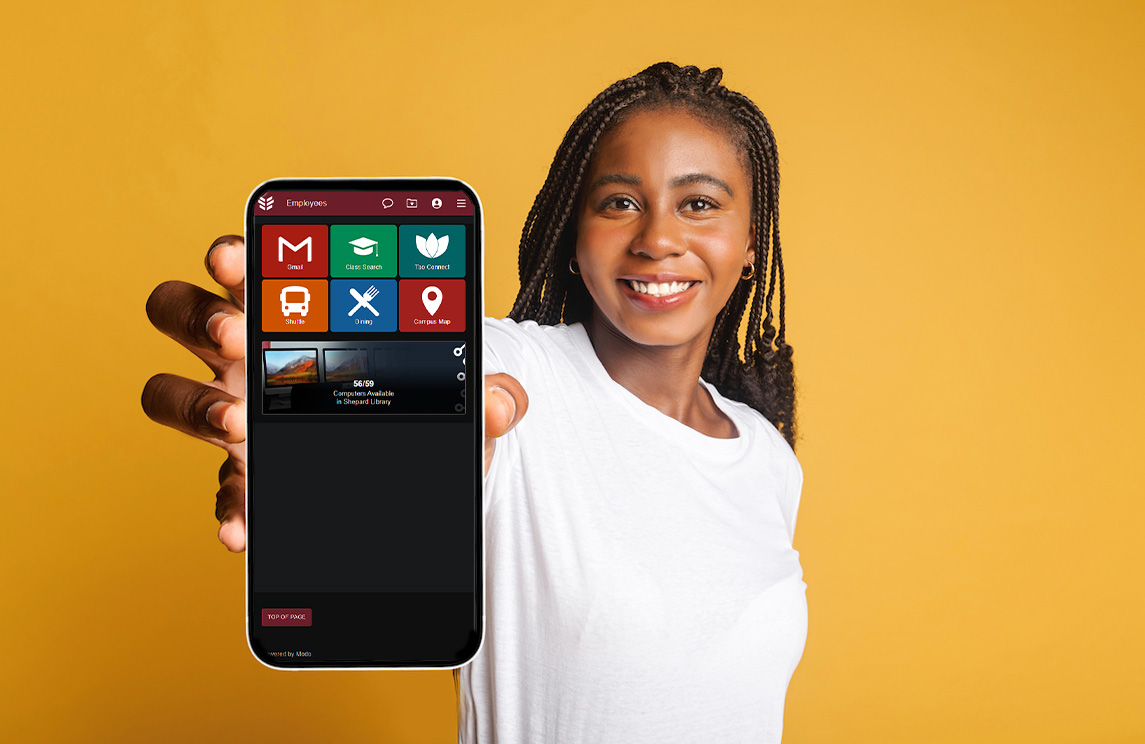 A woman holding up a phone screen