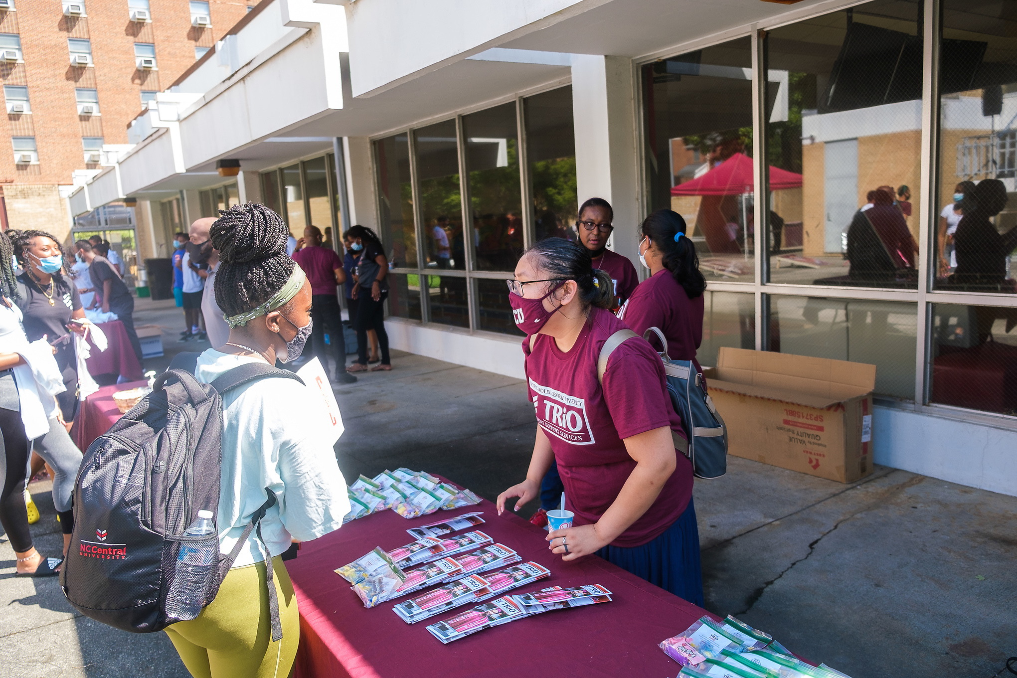 students at fair table