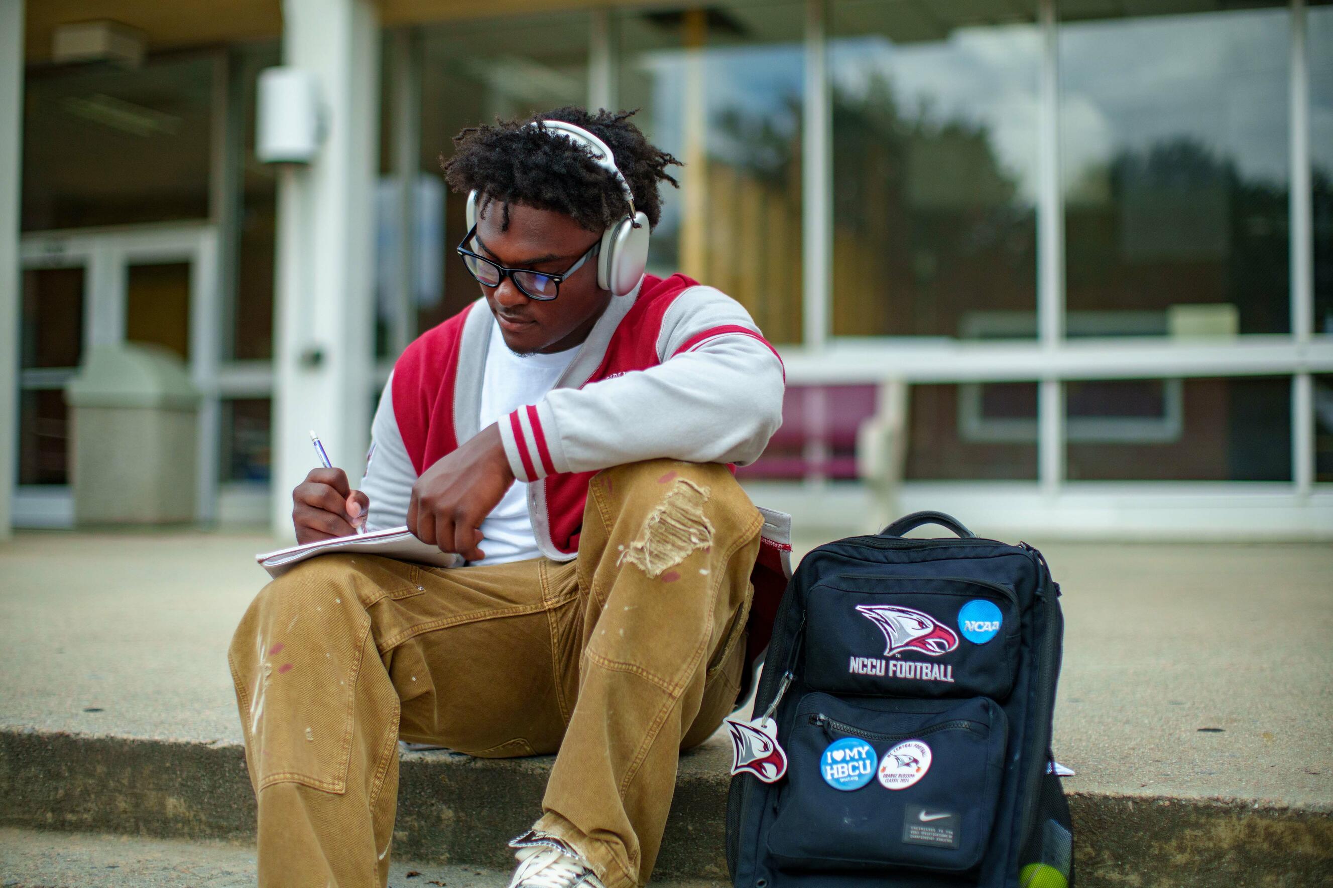 A NCCU student taking notes