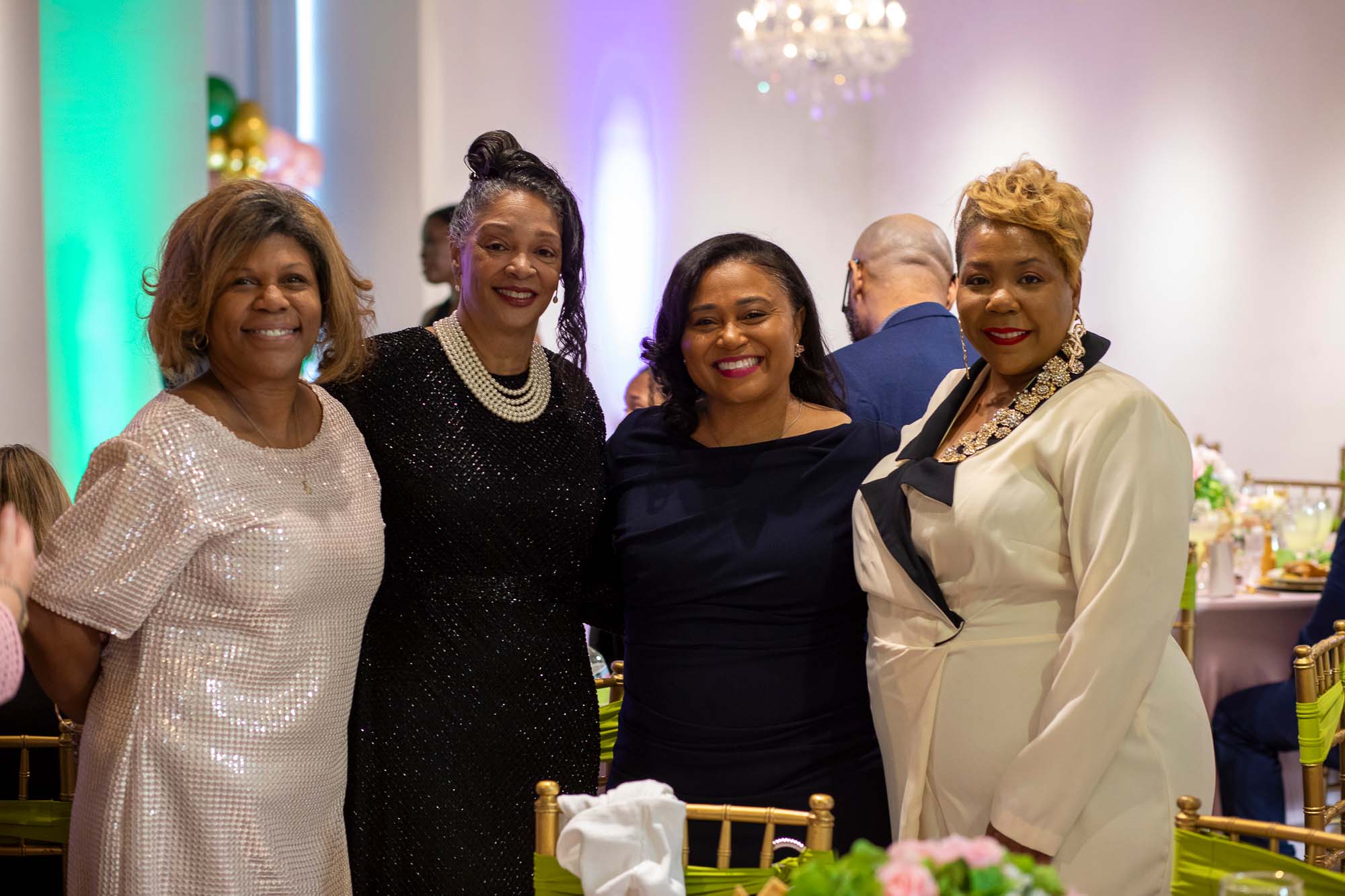 four people at a gala event