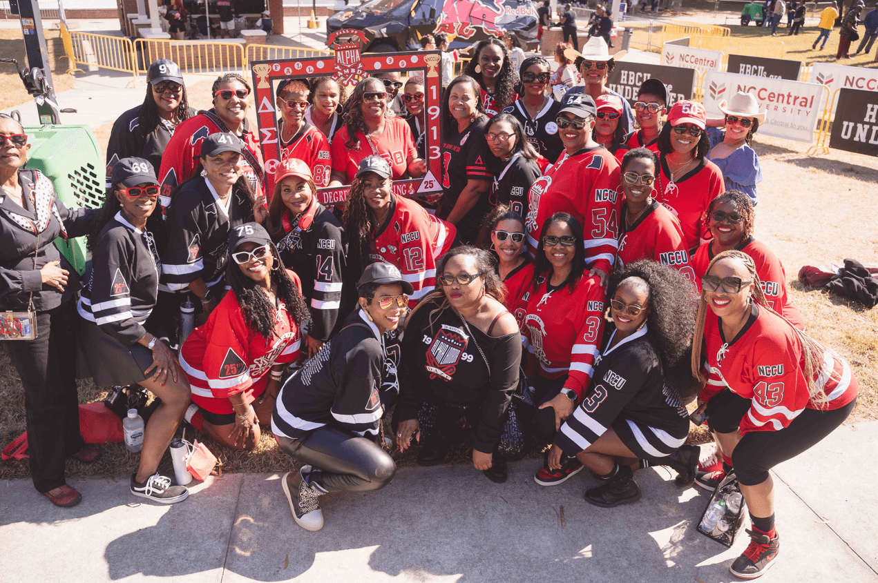 A group of students in red at a NCCU game.