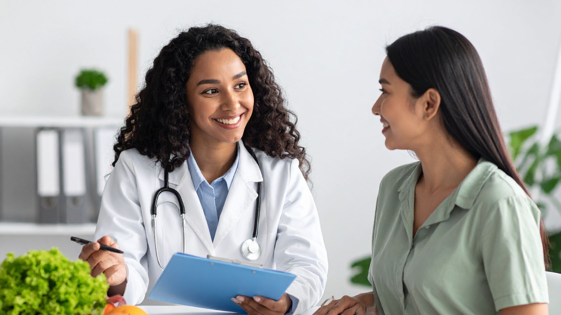 two women talking at clinic