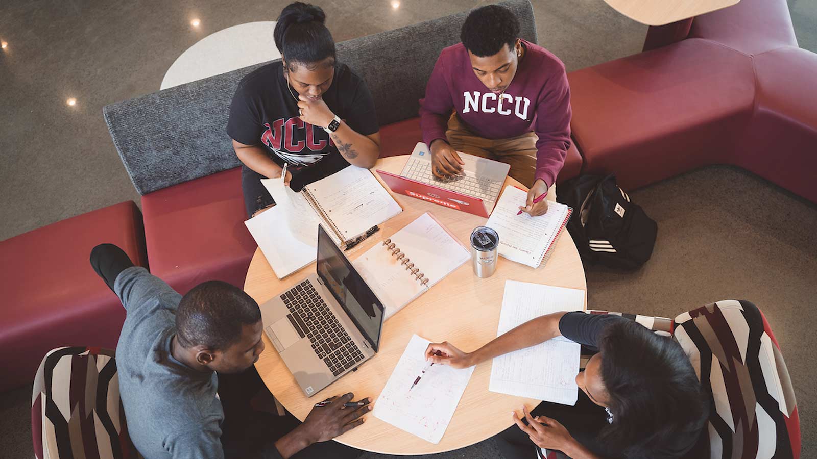nccu students studying at a table