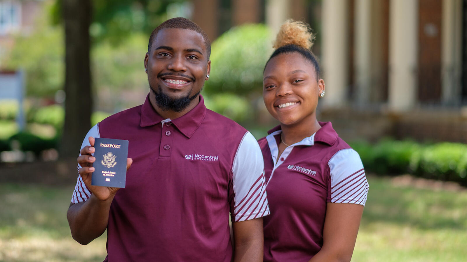 students holding a passport