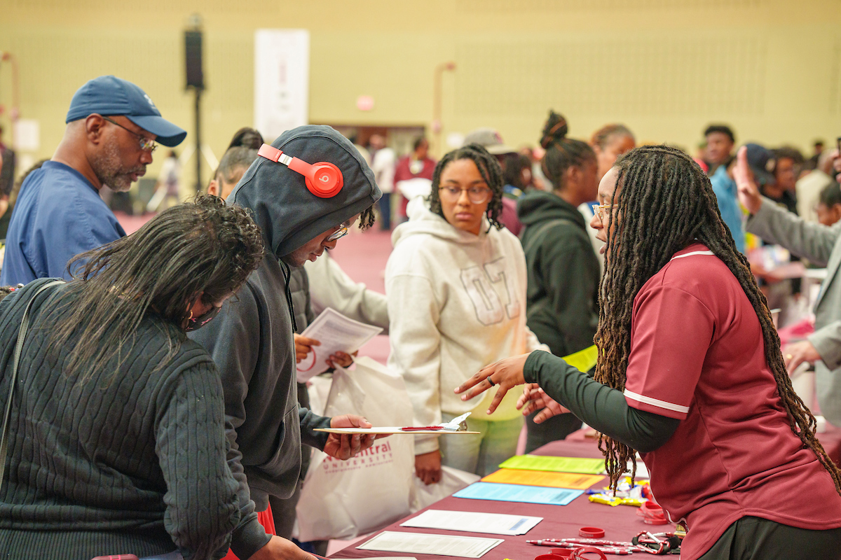 people meeting at education booth