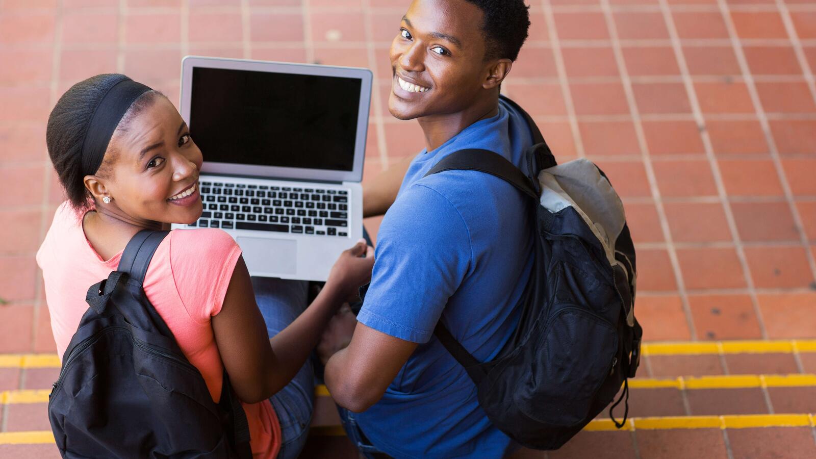 students with laptop