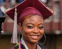 NCCU student at graduate smiling at the camera.