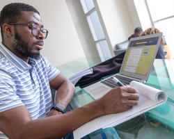 Student taking survey on laptop
