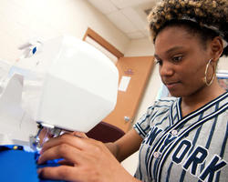 Woman sewing garment
