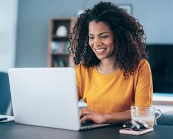 Female Gold Shirt Laptop