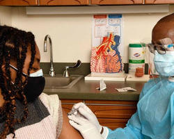 A doctor administering a vaccine.