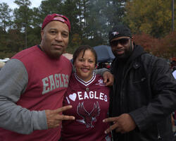 Three Alumni posing for a picture
