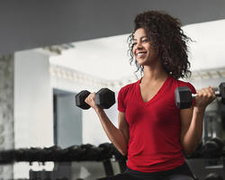African American woman working out in a gym
