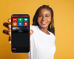 A woman holding up a phone screen