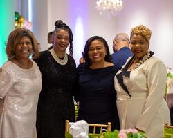 four people at gala