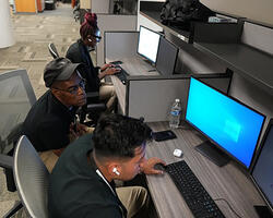 2 students on a PC