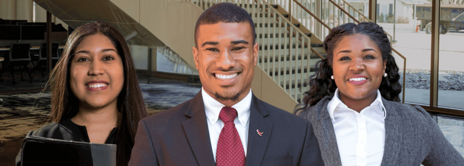 three people in business wear smiling
