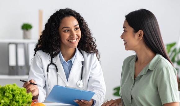 two women talking at clinic