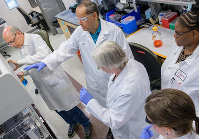 Researchers in lab coats