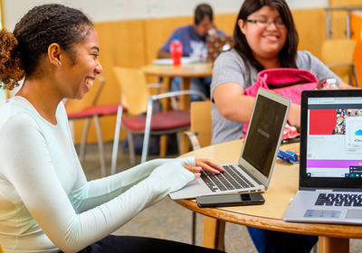 NCCU Students at computers using the new nccu.edu website.