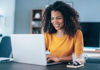 Female Gold Shirt Laptop