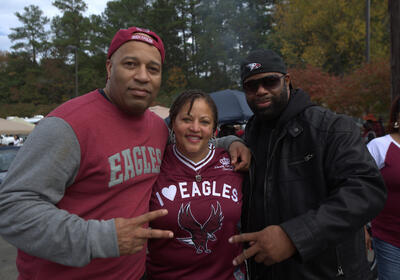 Three Alumni posing for a picture