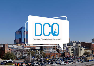 Durham County Forward logo with downtown durham as the background