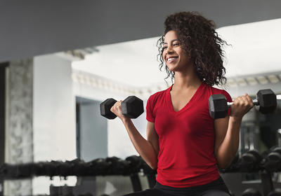 African American woman working out in a gym