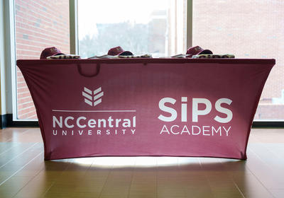 Table with SiPS Academy Banner