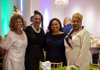 four people at gala