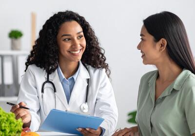 two women talking at clinic